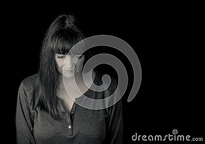 Portrait of a mature troubled woman looking down. Stock Photo