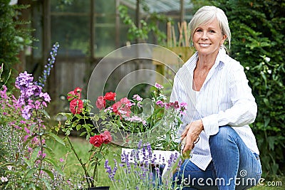 Portrait Of Mature Woman Gardening Stock Photo