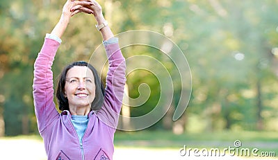 Portrait of mature woman before or after jog in the park Stock Photo