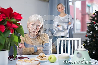 Portrait of a mature woman resentful of her daughter Stock Photo