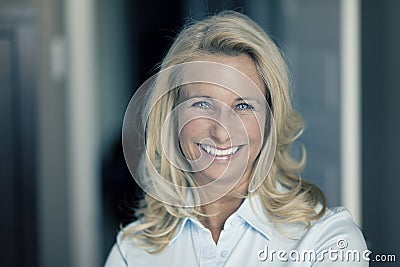 Portrait Of A Mature Woman Smiling At The Camera Stock Photo