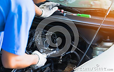 Portrait of Mechanical repairing engine car in workshop Stock Photo