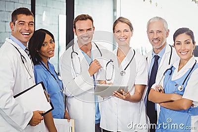 Portrait of medical team standing with digital tablet and clipboard Stock Photo