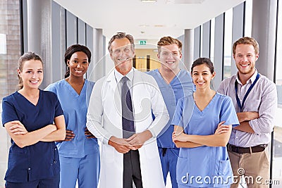 Portrait Of Medical Team Standing In Hospital Corridor Stock Photo