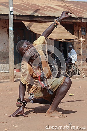 Portrait of a middle-aged black man. A man with mental disorders is dancing in the street Editorial Stock Photo