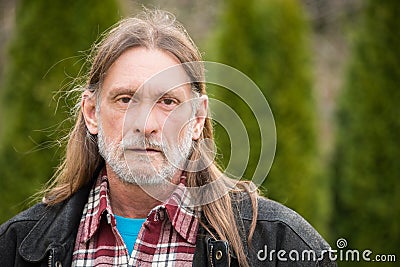 Middle aged man with long hair Stock Photo