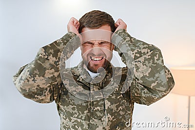 Portrait of middle aged sad, desperate military man. PTSD concept. Horizontal shot Stock Photo