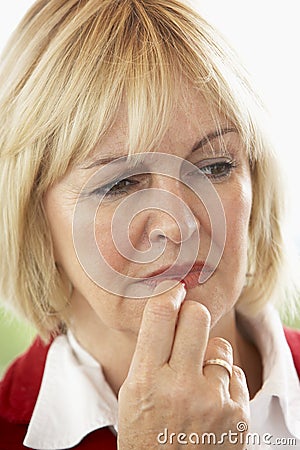 Portrait Of Middle Aged Woman Frowning Stock Photo