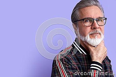 Portrait of minded pensive curious old man in contemplation Stock Photo