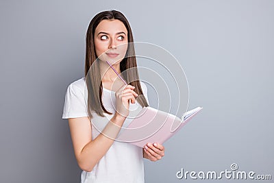 Portrait minded ponder girl look copyspace hold copybook touch pencil chin think thoughts do report on distance corona Stock Photo