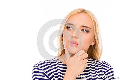 Portrait of minded woman touching her chin and dreaming Stock Photo