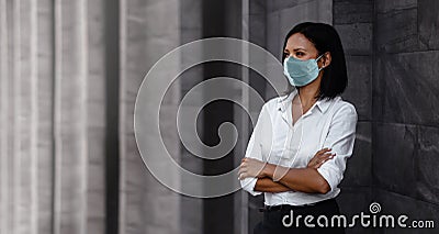 Portrait of a Mixed Races Business Woman, Wearing a Surgical Mask. Healthcare in New Normal Lifestyle Concept. Crossed Arm and Stock Photo