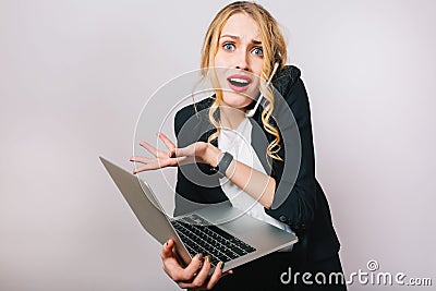 Portrait modern funny blonde office woman in white shirt and black jacket on white background. Working with laptop Editorial Stock Photo