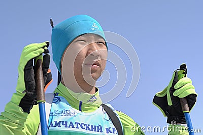 Portrait of Mongolian sportsman biathlete Batkhuyag Taivanbaatar during Regional Junior biathlon competitions East of Cup Editorial Stock Photo