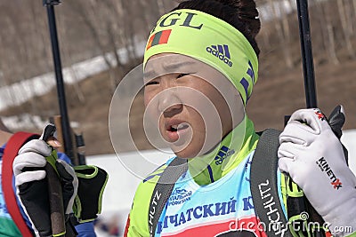 Portrait of Mongolian sportswoman biathlete Doljinsuren Munkhbat during Regional Junior biathlon competitions East of Cup Editorial Stock Photo