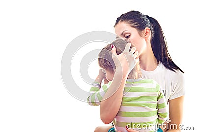 Portrait of mother calms a crying son Stock Photo