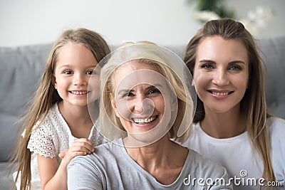 Portrait of mother, daughter and grandmother making family pictu Stock Photo