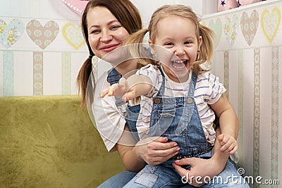 Portrait of mother and laughing daughter Stock Photo