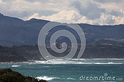 Portrait of mountain trois couronnes rising above atlantic ocean, basque country, france Stock Photo