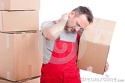 Portrait of mover holding box and having a neck pain Stock Photo