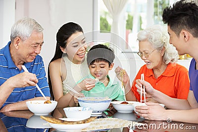 Portrait Of Multi-Generation Chinese Family Eating Stock Photo