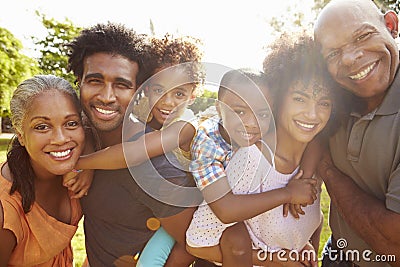 Portrait Of Multi Generation Family In Park Together Stock Photo