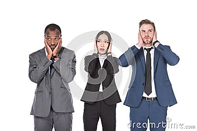 portrait of multicultural young business people covering ears Stock Photo