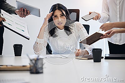 Portrait, multitask and an overwhelmed business woman at work on a laptop in an office for a deadline. Technology Stock Photo