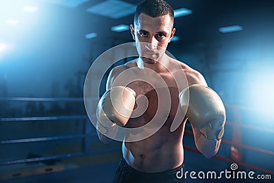 Portrait of muscular boxer in black gloves Stock Photo