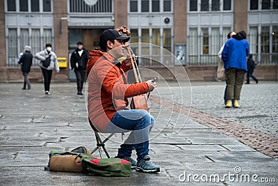 Portrait of musician playing traditional Mongolian violin in the street Editorial Stock Photo