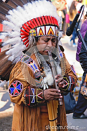 Portrait Of A Native American Playing At A Flute Editorial Image ...