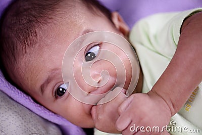 Portrait of newborn baby teething and suck reflex Stock Photo