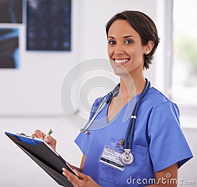 Portrait, nurse and happy woman writing on clipboard in hospital for healthcare, wellness and xray. Face, smile and Stock Photo