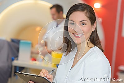 Portrait nurse taking notes in radiology department Stock Photo