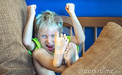 Portrait offended blond boy making freckles face in bad mood, angry waving hands. Funny photo, emotions gesture. Family Stock Photo