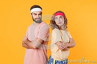 Portrait of offended couple frowning and standing with arms crossed Stock Photo