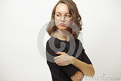 Portrait of an offended or envious woman proudly wraps head back over shoulder on white isolated background. Girl with Stock Photo