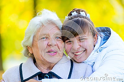 Portrait of an old grandmother and a young granddaughter Stock Photo