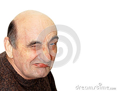 Old man with a grimace on his face Stock Photo