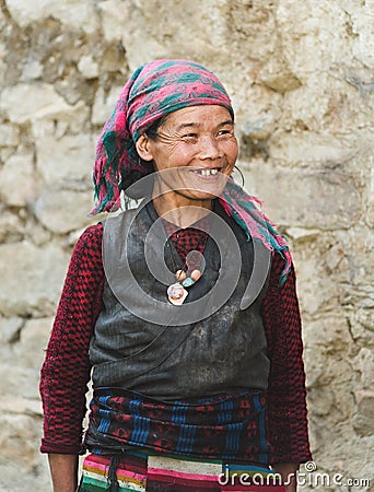 Portrait of a old smiling nepalese woman in national clothes near her Editorial Stock Photo