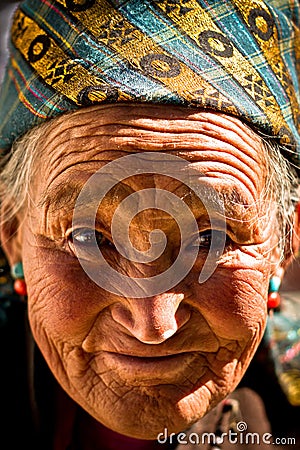 Portrait of an old smiling woman from Tibet Editorial Stock Photo