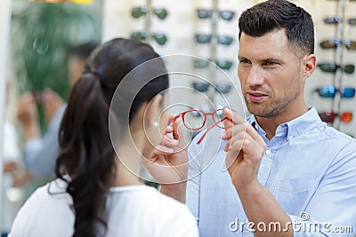 Portrait ophthalmologists with female customer Stock Photo