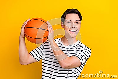 Portrait of optimistic guy with brunet hair wear stylish t-shirt play in university bascketball league isolated on Stock Photo