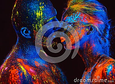 Portrait of a pair of lovers painted in fluorescent powder Stock Photo