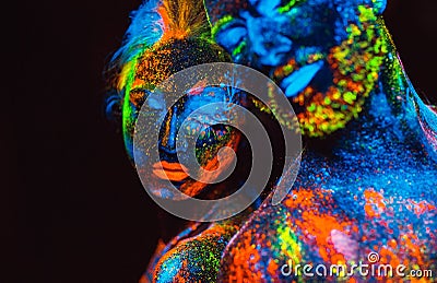 Portrait of a pair of lovers painted in fluorescent powder Stock Photo