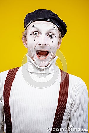 Portrait of a pantomime on the yellow background Stock Photo