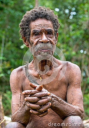 Portrait of a papuan oldman from a korowai tribe Editorial Stock Photo