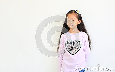 Portrait of peaceful asian little child girl looking beside isolated on white background with copy space Stock Photo