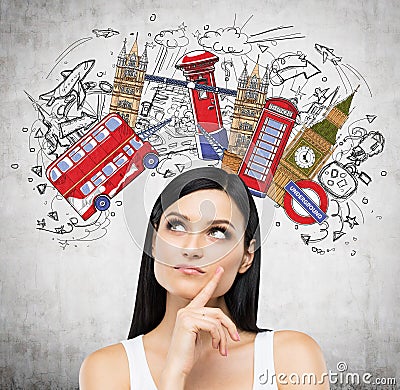 A portrait of a pensive brunette lady in a white tank top. Visiting of Great Britain concept. Stock Photo