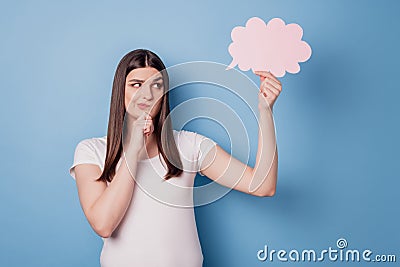 Portrait of pensive doubtful lady finger chin hold thought bubble look empty space on blue background Stock Photo